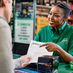 Employee going over a VeriScan report with a customer