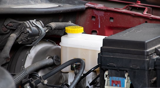 Master cylinder reservoir with brake fluid in 2008 Dodge Nitro