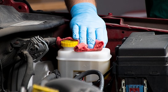 Drying master cylinder with a towel to clean up brake fluid