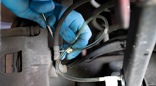 Using box wrench to open brake bleeder valve on a 2008 Dodge Nitro