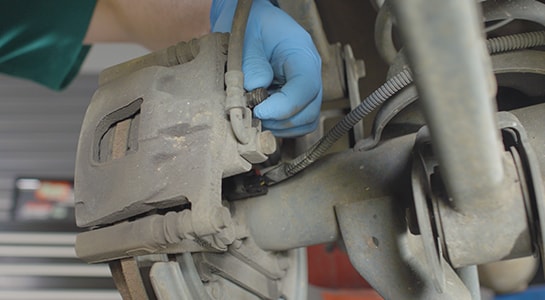 Putting the cap back on the brake bleeder valve