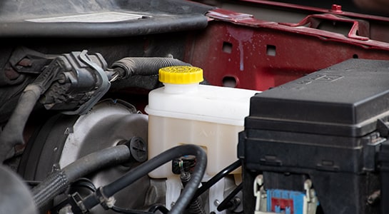 Master cylinder with brake fluid