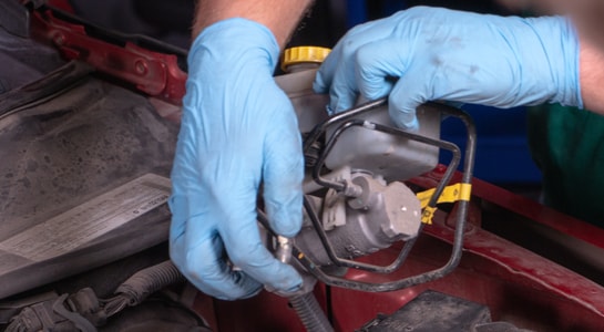 removing brake master cylinder from car