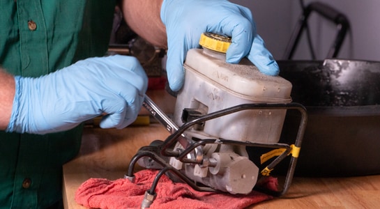 removing threaded plug on brake master cylinder