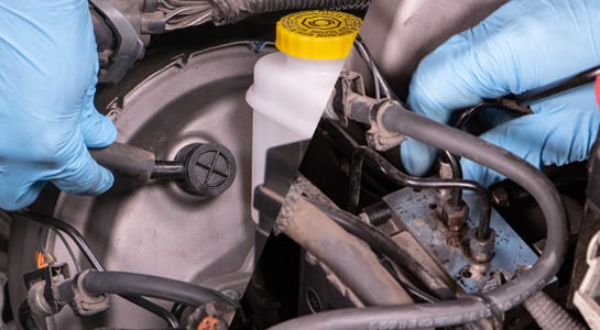 reconnecting vacuum hose, HCU, and brake lines to master cylinder