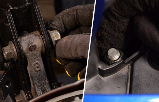 lug nuts being replaced and retightened in the new strut assembly