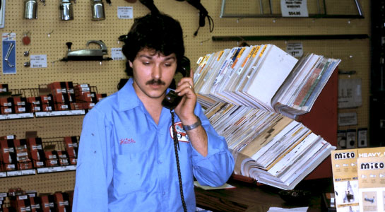 Early photo of an O'Reilly Team Member on the phone.