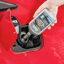 Fuel Additive being added into a vehicle