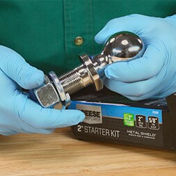 hands holding trailer hitch