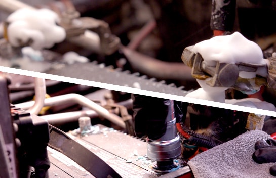 The battery cleaner foam sits to remove any corrosion. Our expert uses a battery brush to work off any corrosion not removed by the cleaner.