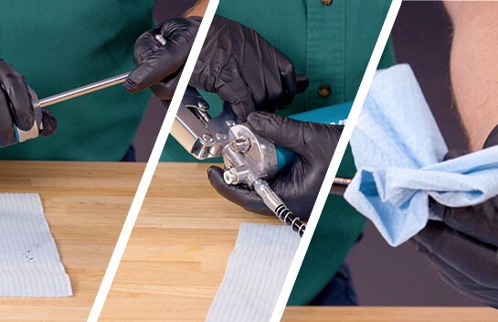 The grease gun is pumped and primed again and the hose end is wiped off.