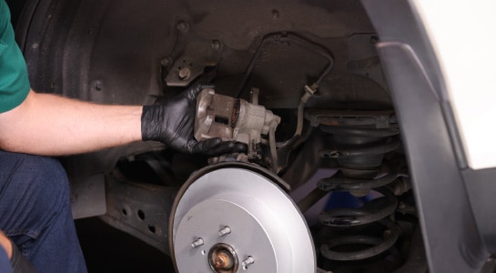 The bleeder tool is disconnected from the vehicle.