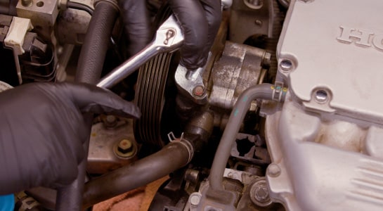 Professional Parts Person removing the hoses