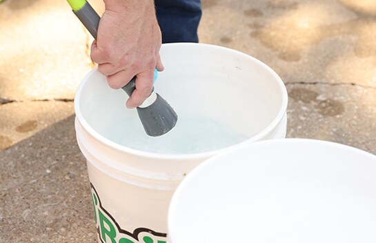 Bucket being filled with water