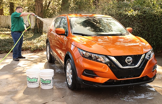 Rinising vehicle off with water