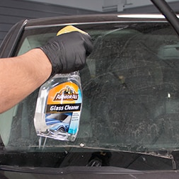 Glass cleaner being applied