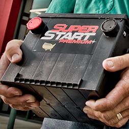 employee carrying battery