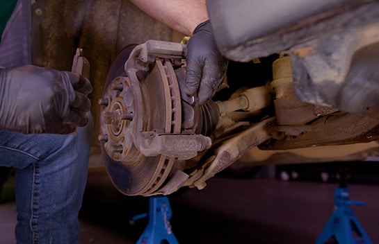 Step 4: Remove the Old Brake Pads from the Caliper Bracket