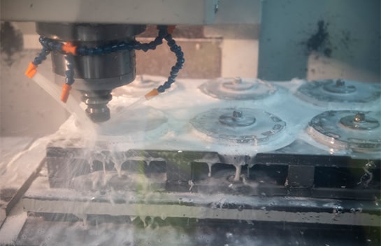 EBC brake pads being sprayed with chemicals by a fabricator