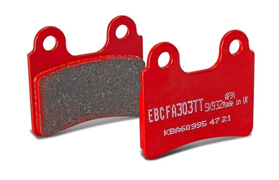 Two red EBC motorcycle brake pads