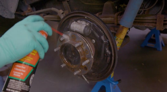 Clean the hub and backing plate with brake cleaner and a shop towel or rag.