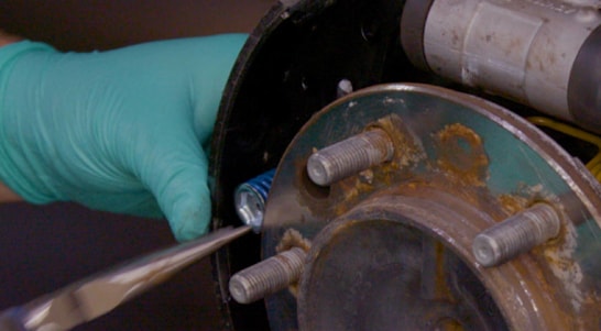 <p>Install the rear brake shoe, ensuring it is properly aligned and seated, then use your brake spring tool or needle nose pliers to install the new pin, shoe hold-down spring, and shoe hold-down cup. </p>