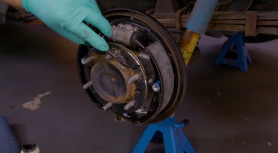 Apply silicone grease to prevent corrosion between the drum and the axle. 