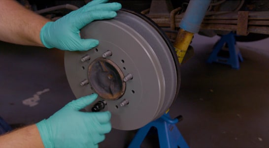 Install the brake drum, and use a lug nut to keep it in place for the time being.