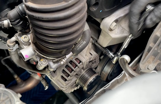 Loosen the two mounting bolts.