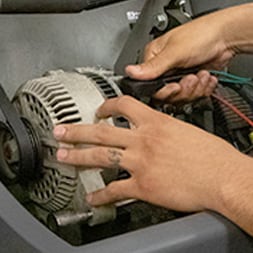 Alternator being tested by an O'Reilly employee