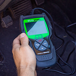 Veriscan Device in Hand Testing Vehicle