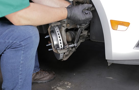 Tighten the caliper bracket bolts to 74 foot-pounds on a first pass, then another 60 to 75 degrees.