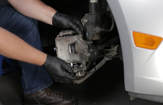 Reinstall the caliper, then tighten the bolts to 21 foot-pounds.