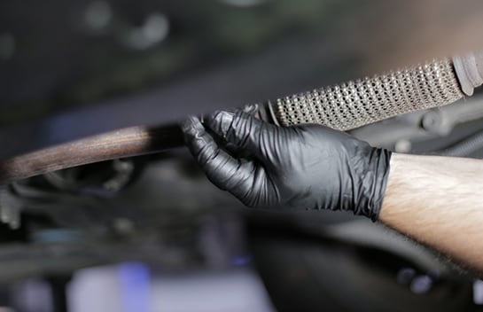 Thread the drain plug back into place by hand before torquing to 124 inch-pounds.