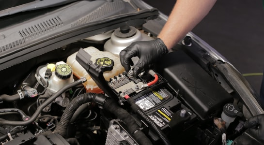 Reattach the cables to the studs in the fuse block.