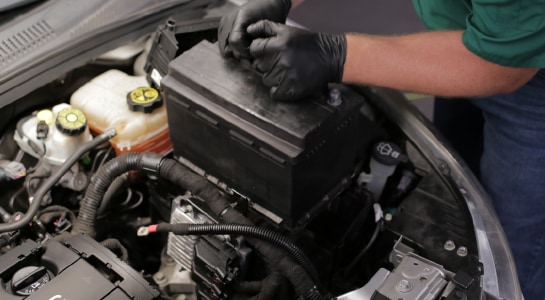 Lift the old battery out of the engine bay.