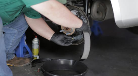 Attach the parking brake cable to the parking brake lever. 