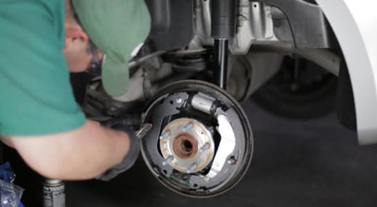 Use pliers to turn the spring retainer caps to the locked position.