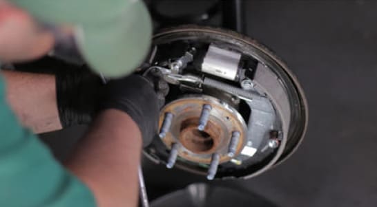 Install the adjuster spring.