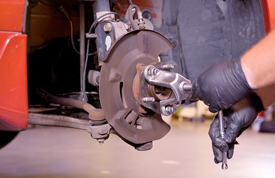 Use a 3/4” or 19mm wrench or socket to press the axle shaft through the hub.