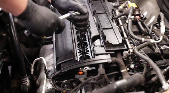Loosen your spark plugs about one turn using the appropriate spark plug socket and a ratchet.