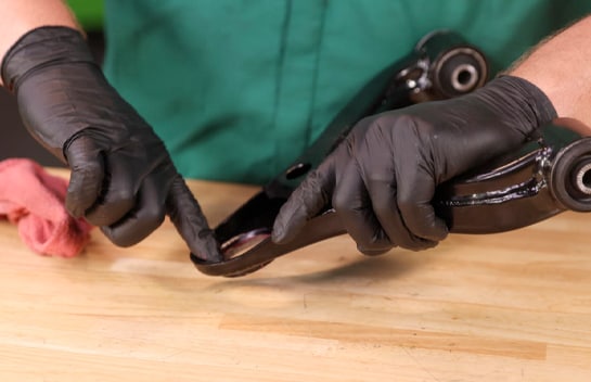 Clean and lubricate the opening for the new ball joint.