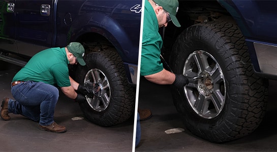 Auto parts professional loosening the rear wheel lug nuts on a Ford F-150