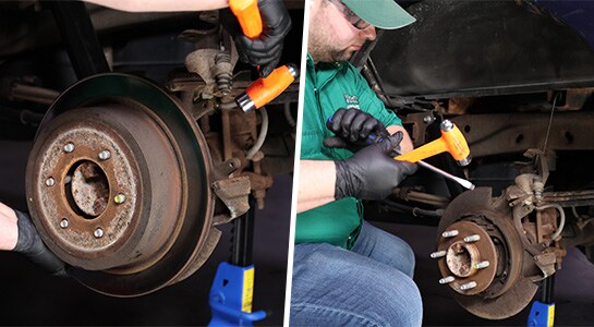 Auto parts professional removing a rotor from a Ford F-150