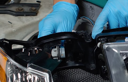 The Headlight Assembly Wiring harness is transferred to the new assembly from the old one.