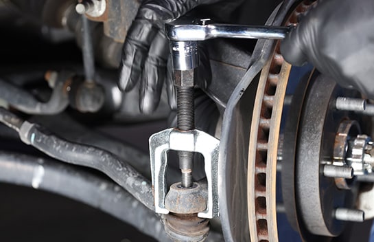 Use a 17mm or 11/16” socket or wrench to turn the pressure screw and press the pitman arm or tie rod off.
