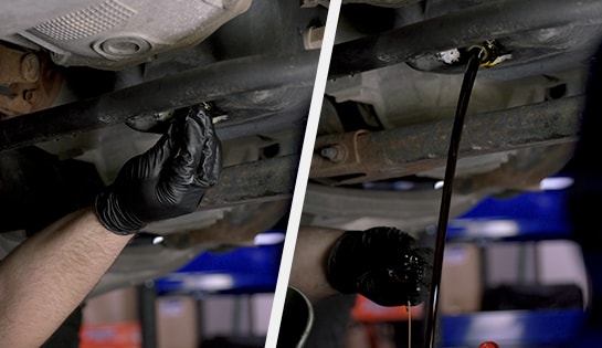 Auto parts professional removing a drain plug and oil from a Ford F-150