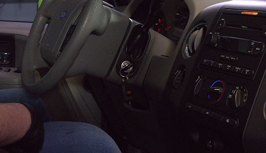 Auto parts professional resetting the oil life light in a 2006 Ford F-150